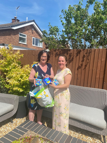 Pauline Latham OBE MP handing over donation to Duffield Ukrainian Support Group