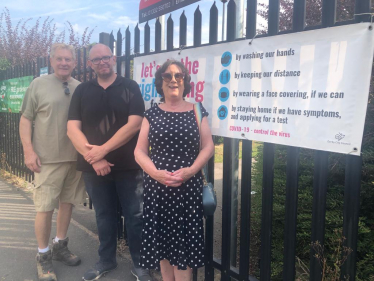 Outside Portway School examining the potential crossing point. 