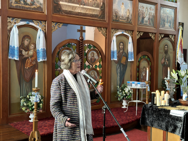 Pauline speaking at church service