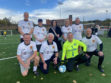 Pauline Latham OBE MP with walking football team